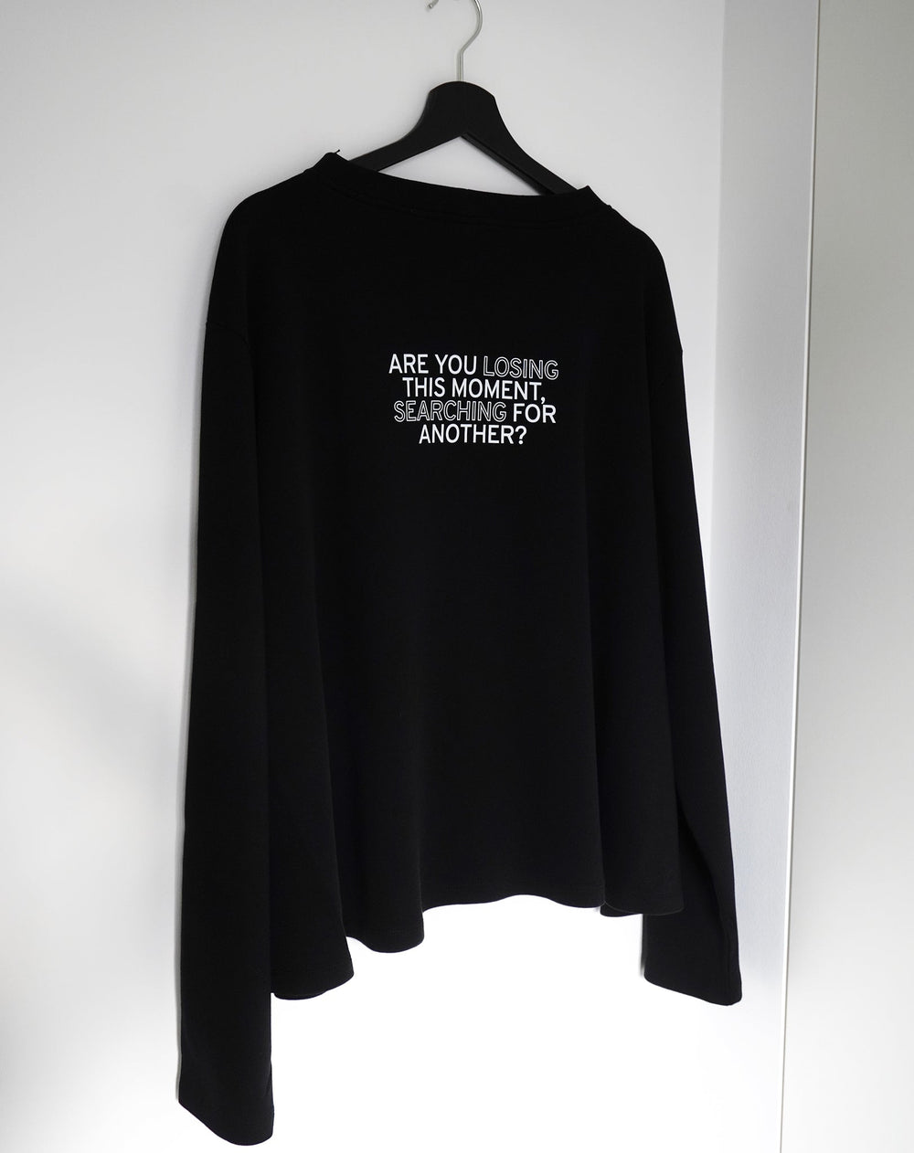 Are you losing this moment searching for another? Black Flowy Long Sleeve