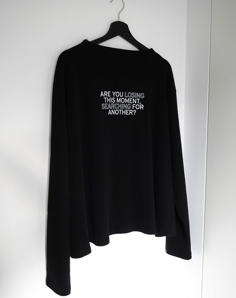 Are you losing this moment searching for another? Black Flowy Long Sleeve