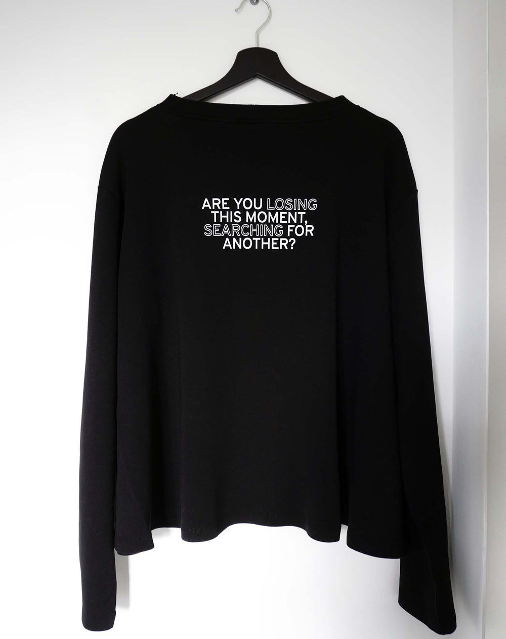 Are you losing this moment searching for another? Black Flowy Long Sleeve